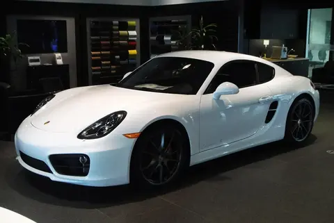A Porsche Cayman S (981 generation) shown from the side, the first Cayman built with electric rather than hydraulic power steering.
