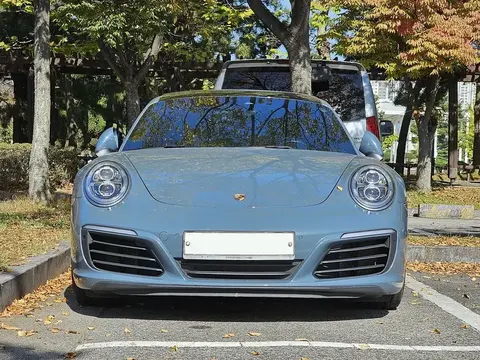 A Porsche 991.2 911 Carrera in Graphite Blue Metallic, from the 2016 model year that switched every Carrera to a 3.0-litre twin-turbo flat six.