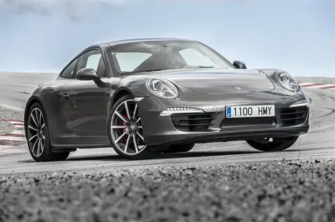 A 2013 Porsche 911 Carrera 4S (991) in three-quarter view, from the generation that switched to a part-aluminium bodyshell.