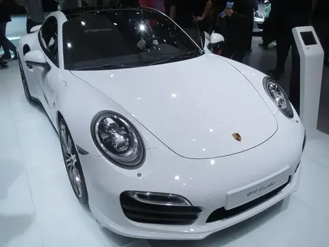 A Porsche 911 Turbo (991) shown front-on at the 2013 Frankfurt motor show, fitted with the generation's active rear wing.