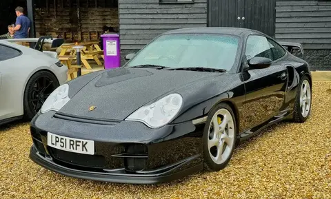 A 2001 Porsche 911 996 GT2 shown front three-quarter, the rear-drive GT2 that received ceramic brakes ahead of the Turbo.