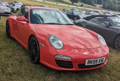 A 2009 Porsche 911 Carrera 2S (997.2) photographed front three-quarter, the facelifted generation that introduced direct fuel injection.