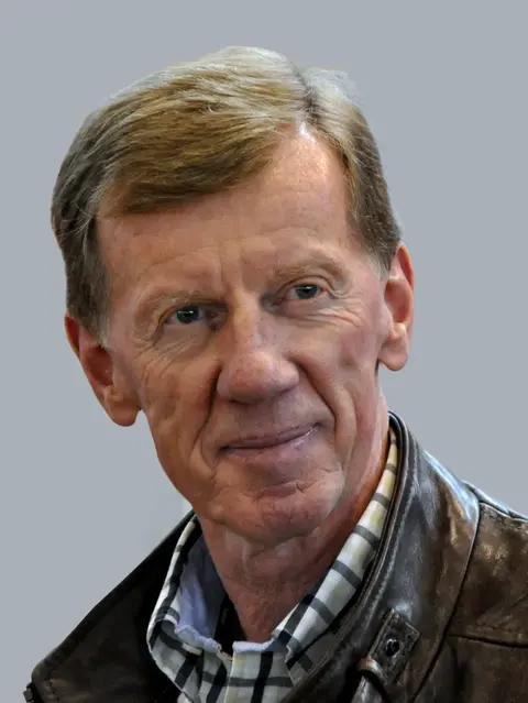 Portrait of rally legend Walter Röhrl, who set his 7:32 Nordschleife lap in a 997 GT2 on a public track day.