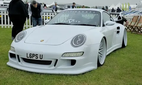 A 2006 Porsche 911 997 Turbo shown front three-quarter, the generation built with reinvented diesel-truck-derived turbochargers.