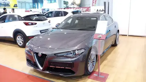 A 2016 Alfa Romeo Giulia sedan photographed front three-quarter, the model that revived rear-wheel drive for an Alfa saloon.