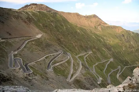 The Stelvio Pass in the Italian Alps, famous for the 48 tight hairpin switchbacks that give the Alfa Romeo Stelvio its name.