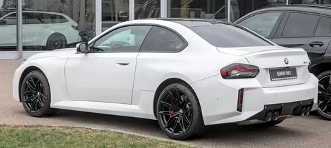 A BMW M2 of the G87 generation photographed outdoors, one of the last new performance cars offered with a manual gearbox.