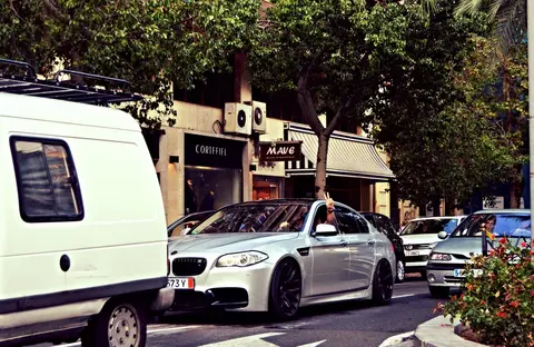 A BMW M5 of the F10 generation photographed outdoors, the first turbocharged car to wear the M5 badge.