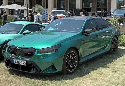 A BMW M5 (G90), the plug-in hybrid generation that became the heaviest M5 ever built.