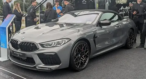 A BMW M8 Convertible with its roof down, sharing its twin-turbo V8 and all-wheel-drive system with the contemporary M5.