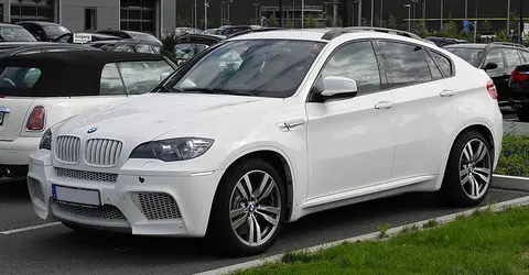 A BMW X6 M of the E71 generation photographed from the front in Dusseldorf, the model that gave BMW M's S63 twin-turbo V8 its production debut.
