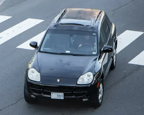 A first-generation Porsche Cayenne, Porsche's first four-door production model and first V8 since the 928.