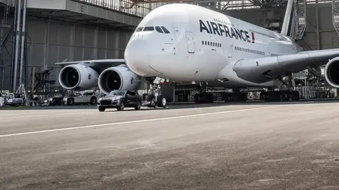 A Porsche Cayenne S Diesel towing a 265-tonne Air France Airbus A380, the Guinness World Record pull.