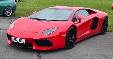 A 2013 Lamborghini Aventador LP700-4 shown side on, its carbon fibre monocoque hidden beneath the bodywork.
