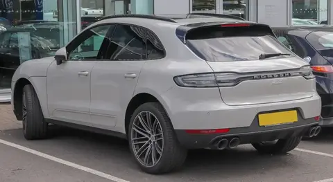 Rear view of a facelifted Porsche Macan 2.0 showing the continuous LED light bar spanning the tailgate.