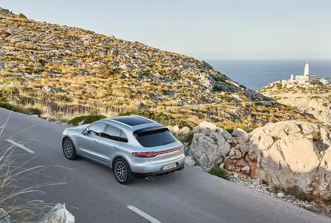 Rear three-quarter view of a facelifted Porsche Macan S showing its quad exhaust tips, from the generation that introduced a new single-turbo 3.0-litre V6.