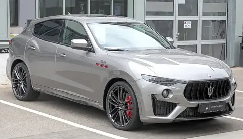 A grey Maserati Levante Trofeo SUV photographed from the front three-quarter angle.