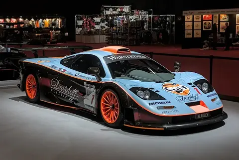 The 1997 McLaren F1 GTR Longtail race car in Gulf livery on display at the Geneva International Motor Show, the homologation racer the 675LT's name references.