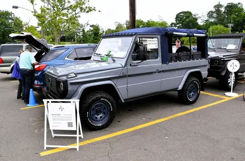An early Mercedes-Benz G-Klasse 230 GE parked outdoors, front three-quarter view.