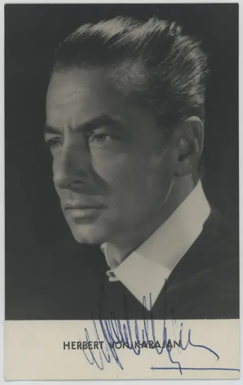 Formal black-and-white portrait of conductor Herbert von Karajan, who ordered a bespoke featherweight 911 Turbo from the factory in 1974